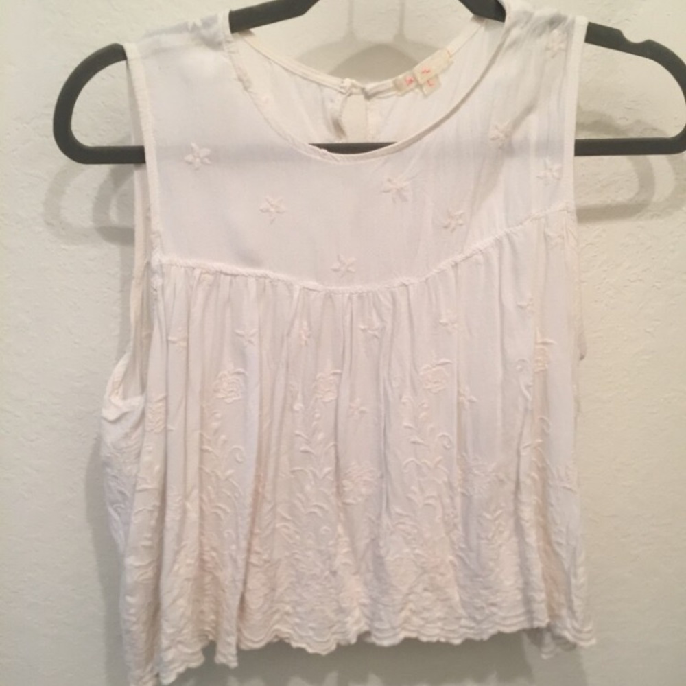 Unique white top with flower buttons